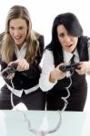 Female Partners Playing Game And Holding Remote Stock Photo