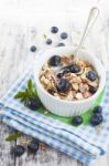 Bowl Of Muesli With Fresh Blueberries On White Wooden Table Stock Photo