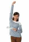 Girl Enjoying Ipad With Raised Arm Stock Photo