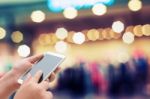 Woman Using Smart Phone On Night Street Stock Photo