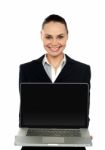 Female Executive Presenting Brand New Laptop Stock Photo