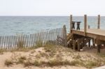 Wooden Bridge Through Sand Dunes Stock Photo