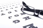 Eyeglasses Over Eye Chart Stock Photo