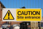 Caution Site Entrance Sign Stock Photo