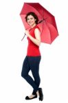 Casual Shot Of A Trendy Woman With An Umbrella Stock Photo