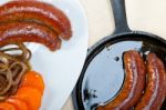 Beef Sausages Cooked On Iron Skillet Stock Photo