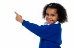 Adorable African Kid Pointing At Copy Space Area Stock Photo