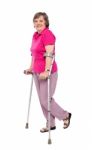 Senior Lady Walking With Crutches Stock Photo