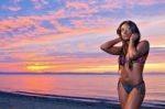 Beautiful Black African American Woman Posing On The Beach At Su Stock Photo