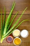 Facial Treatment Recipe With Fresh Aloe Vera On Wood Background Stock Photo