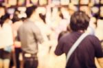 Blurred Crowd Of People Watching Art Exhibition In The Hall Stock Photo