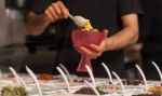 Man Topping Ice-cream With Gems And Jellies Stock Photo