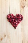 Heart Formed By Red Rose Petals On Wooden Background Stock Photo