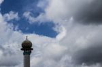 Minaret With Clouds In The Background Stock Photo