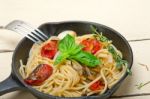 Spaghetti Pasta With Baked Cherry Tomatoes And Basil Stock Photo