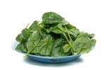 Bunch Of Fresh Spinach On A Dish Stock Photo