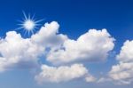 Blue Sky With White Clouds And Sun Stock Photo