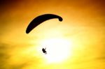 Silhouette Of Parachute On Sunset Stock Photo