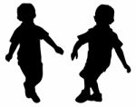 Silhouettes Of Two Little Boys Stock Photo