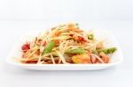 Thai Food Papaya Salad On White Dish Stock Photo