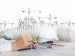 Architect Working On Talbe With Sketching And Building Construct Stock Photo