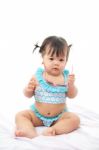 Portrait Baby Girl In Swimsuit On White Background Stock Photo