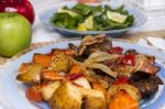 Oven Baked Meat With Potatoes, And Watercress Salad Stock Photo