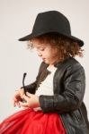 Little Girl Fashion Model With Black Hat Stock Photo