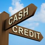 Cash Or Credit Signpost Stock Photo