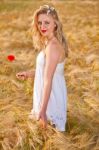 Portrait Of Beautiful Girl In Field Stock Photo