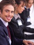 Closeup Of Attractive Business Men With Colleague Stock Photo