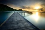 The Wooden Bridge With Sunrise At National Park Khao Leam Ya - M Stock Photo