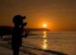 Silhouette Of Child On Sunset Beach Stock Photo