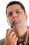 Male Holding Smoking Pipe Stock Photo