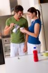 Couple In Kitchen Stock Photo