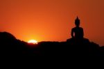 Sunset And Buddha Stock Photo