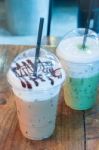 Take-home Ice Coffee Cup On Wooden Table Stock Photo