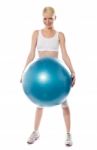 Smiling Female Holding Blue Ball Stock Photo