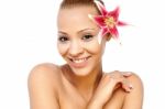 Smiling Young Woman With A Lily Flower Stock Photo