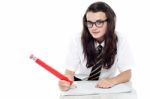 Schoolgirl Holding Pencil Stock Photo