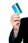 Cropped Image Of A Man Showing Credit Card Stock Photo