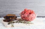 Raw Minced Meat With Bread And Rosemary Stock Photo