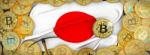 Bitcoins Gold Around Japan  Flag And Pickaxe On The Left.3d Illu Stock Photo