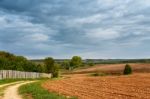 Spring Storm Clouds Above Country Road Stock Photo