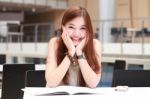 Portrait Of Thai Adult Beautiful Girl Write A Book And Smile In University Stock Photo