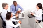 Multi Ethnic Team During Meeting Stock Photo