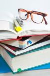 Book Stack With Reading Glasses Stock Photo