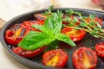 Baked Cherry Tomatoes With Basil And Thyme Stock Photo