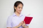 Asia Thai High School Student Uniform Beautiful Girl Read A Book Stock Photo