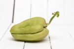 Chayote Fruit On White Wood Background Stock Photo